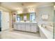 Spacious bathroom with double sinks, a soaking tub, and a walk-in shower at 2905 Cavalcade Cir, Johns Island, SC 29455