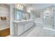 This luxurious bathroom has double sinks, a large mirror, and a separate shower and tub at 2905 Cavalcade Cir, Johns Island, SC 29455