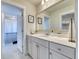 Bright and modern bathroom with a vanity featuring clean lines and a view to the shower and walk-in closet at 2905 Cavalcade Cir, Johns Island, SC 29455