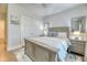 Cozy bedroom featuring a large bed, nightstands, and hardwood floors at 2905 Cavalcade Cir, Johns Island, SC 29455