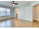 Bedroom with beautiful hard wood floors, ceiling fan, and natural light from the window at 2905 Cavalcade Cir, Johns Island, SC 29455