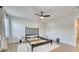 A bright bedroom with hardwood floors, a modern ceiling fan, and an empty bed frame on a white rug at 2905 Cavalcade Cir, Johns Island, SC 29455