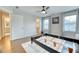 Bright and spacious bedroom with two windows, hardwood floors, and an en suite bathroom at 2905 Cavalcade Cir, Johns Island, SC 29455