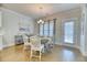 Charming dining area with a round table and chairs, with natural light streaming in at 2905 Cavalcade Cir, Johns Island, SC 29455