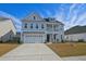 Charming two-story home with a two car garage, beautiful balcony and inviting curb appeal at 2905 Cavalcade Cir, Johns Island, SC 29455