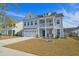 Charming two-story home with a two car garage, beautiful balcony and inviting curb appeal at 2905 Cavalcade Cir, Johns Island, SC 29455