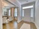 Bright foyer with hardwood floors, paneled doors, and an open view to the living room at 2905 Cavalcade Cir, Johns Island, SC 29455