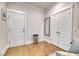 Hallway features hardwood floors, modern doors and trim, plus a gray framed mirror at 2905 Cavalcade Cir, Johns Island, SC 29455