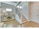 Hallway features stairs with black metal spindles, white trim and an adjacent console table at 2905 Cavalcade Cir, Johns Island, SC 29455