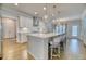 Bright kitchen features a large island with pendant lighting and hardwood floors at 2905 Cavalcade Cir, Johns Island, SC 29455