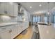 Spacious kitchen boasts white cabinetry, stainless steel appliances, and an open floor plan at 2905 Cavalcade Cir, Johns Island, SC 29455