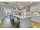 A great shot of the kitchen island with barstool seating, stainless appliances, and pendant lighting at 2905 Cavalcade Cir, Johns Island, SC 29455