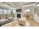 Bright open concept living room featuring a fireplace, TV, and hardwood floors at 2905 Cavalcade Cir, Johns Island, SC 29455