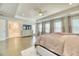 Spacious primary bedroom boasts hardwood floors, natural light, and an ensuite bathroom at 2905 Cavalcade Cir, Johns Island, SC 29455