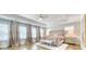 Spacious main bedroom features a tray ceiling, hardwood floors, and lots of natural light at 2905 Cavalcade Cir, Johns Island, SC 29455