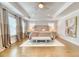 This spacious main bedroom has hardwood floors and large windows for lots of natural light at 2905 Cavalcade Cir, Johns Island, SC 29455