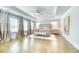 Bright main bedroom with hardwood floors, neutral decor, and a large bed with sitting area at 2905 Cavalcade Cir, Johns Island, SC 29455