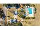 Aerial view of luxury estate featuring a pool, guest houses, and lush grounds, offering privacy and elegance at 292 Lotz Dr, Summerville, SC 29483
