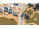 Aerial view of a property showcasing its pond, landscaping, and proximity to neighborhood amenities at 292 Lotz Dr, Summerville, SC 29483