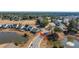 Aerial view of a home nestled in a community featuring well-maintained landscaping and a lake at 292 Lotz Dr, Summerville, SC 29483