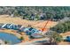 A captivating aerial view showcases a beautiful house with a serene pond nearby at 292 Lotz Dr, Summerville, SC 29483
