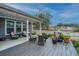 Cozy covered back porch and deck space with comfortable seating and relaxing water views at 292 Lotz Dr, Summerville, SC 29483