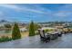 Beautiful back porch with lovely chairs and a fire pit provides a serene waterfront view at 292 Lotz Dr, Summerville, SC 29483