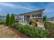 Spacious deck with a covered patio and lush greenery offers a great outdoor living space at 292 Lotz Dr, Summerville, SC 29483