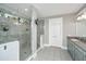 Bright bathroom featuring tiled shower with glass door, double door storage, and granite countertop vanity at 292 Lotz Dr, Summerville, SC 29483