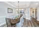 Elegant dining area featuring a wood table with seating, chandelier lighting, and a classic design at 292 Lotz Dr, Summerville, SC 29483