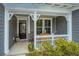 Inviting front porch featuring decorative trim, seating, and a charming exterior at 292 Lotz Dr, Summerville, SC 29483