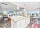 Kitchen with a large island and white cabinets with a view to the living room at 292 Lotz Dr, Summerville, SC 29483