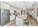 Modern kitchen with large island featuring granite countertops and stainless steel appliances at 292 Lotz Dr, Summerville, SC 29483