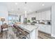Bright kitchen features a large island with seating and modern white cabinetry at 292 Lotz Dr, Summerville, SC 29483