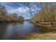 Scenic lake view with trees. A peaceful lakeside setting at 292 Lotz Dr, Summerville, SC 29483