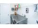 Modern laundry room featuring new washer and dryer and wire shelving at 292 Lotz Dr, Summerville, SC 29483