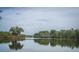 Scenic pond view with trees reflecting on water at 292 Lotz Dr, Summerville, SC 29483