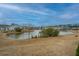 Scenic waterfront view features a tranquil pond surrounded by well-maintained homes and landscaping at 292 Lotz Dr, Summerville, SC 29483