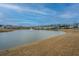 Picturesque waterfront view showcases the community's pond with a fountain and surrounding homes at 292 Lotz Dr, Summerville, SC 29483