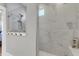 Modern bathroom with a glass-enclosed shower featuring marble-style tile and built-in niche at 302 Autumn Azalea Way, Summerville, SC 29486