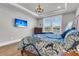 Bedroom features wood flooring, a decorative dresser, and a wall-mounted television at 302 Autumn Azalea Way, Summerville, SC 29486