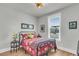Cozy bedroom features wood floors, bright windows, and decorative side table at 302 Autumn Azalea Way, Summerville, SC 29486