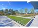 Bocce ball court with shade structures at Latitude Margaritaville Watersound at 302 Autumn Azalea Way, Summerville, SC 29486