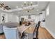 Dining area seamlessly connects to the living room and kitchen, featuring a large table and ample seating at 302 Autumn Azalea Way, Summerville, SC 29486