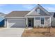 Attractive single-Gathering house with a neat lawn, convenient driveway, and attached garage at 302 Autumn Azalea Way, Summerville, SC 29486