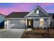 Charming single-Gathering home with a well-manicured lawn and attached garage at 302 Autumn Azalea Way, Summerville, SC 29486