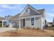 Well-maintained single-story home with an attached garage and manicured front yard at 302 Autumn Azalea Way, Summerville, SC 29486