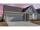 Attractive single-Gathering house with a neat lawn, convenient driveway, and attached garage at 302 Autumn Azalea Way, Summerville, SC 29486