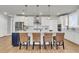 Modern kitchen featuring white cabinets, stainless steel appliances, and a spacious island at 302 Autumn Azalea Way, Summerville, SC 29486