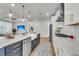 Beautiful open kitchen features an island with a sink, stainless steel appliances, and plenty of counter space at 302 Autumn Azalea Way, Summerville, SC 29486